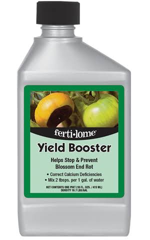 Bottle of Ferti-Lome Yield Booster with a green label describing it as a calcium supplement to stop and prevent blossom end rot; mix 2 tablespoons per gallon of water.